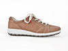 taupe leather trainers with white and brown rubber sole and bright red ends to the laces. 
