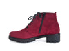 Side view of wine red nubuck suede ankle boots with black chunky grippy sole and heel