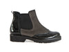 Brogue style ankle boot with patent black leather and taupe brown nubuck. Elasticated side and zip. Thick rubber sole. 