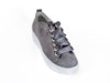 Overhead view of grey nubuck leather trainers with feature ribbon laces and thick white non-slip soles - Ellie Dickins Shoes
