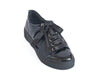 Shiny black ladies shoe with ribbon laces and a thick flat black sole
