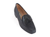 Smart black leather ladies loafer with black suede tassel on the top and the feature stitching detail of a moccasin shoe. 