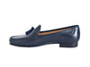 Smart navy blue leather ladies loafer with black suede tassel on the top and the feature stitching detail of a moccasin shoe. 