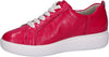 Bright red leather trainers with wide white ribbon laces and thick white cushioned sole. 