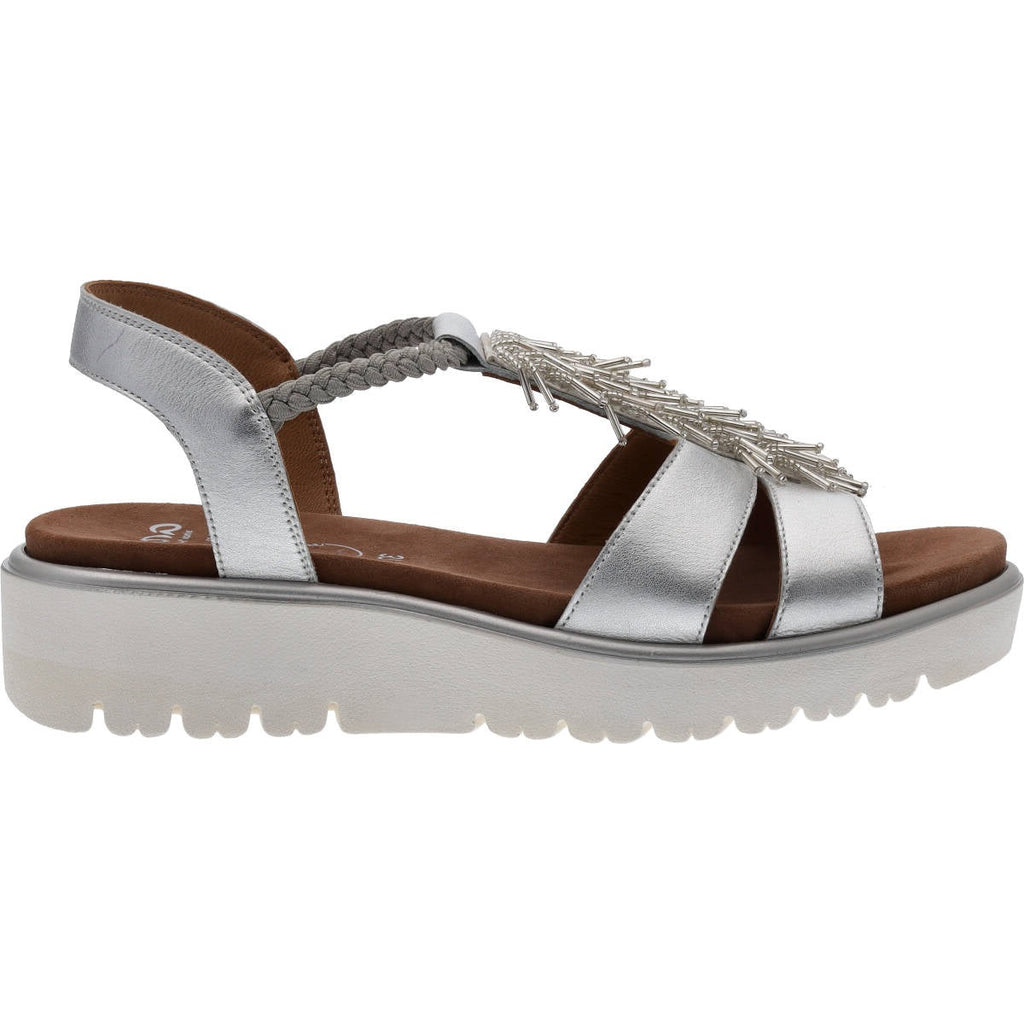 Silver leather sandal with white ribbed sole, silver bead tassel detail and tan leather insole. 