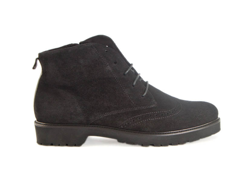 Side view of black suede brogue style ladies ankle boots with flat black heel and sole and skinny laces