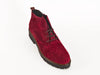 Overhead view showing punched detail on top of Bordeaux wine red suede brogue style ladies ankle boots with flat black heel and sole and skinny laces