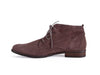 Side view of grey brown nubuck leather desert boot with wood effect flat heel and brogue style punched toe detail