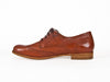 Side view of smart brown leather ladies brogue shoes with fine laces, flat heel and elegant punched leather detail