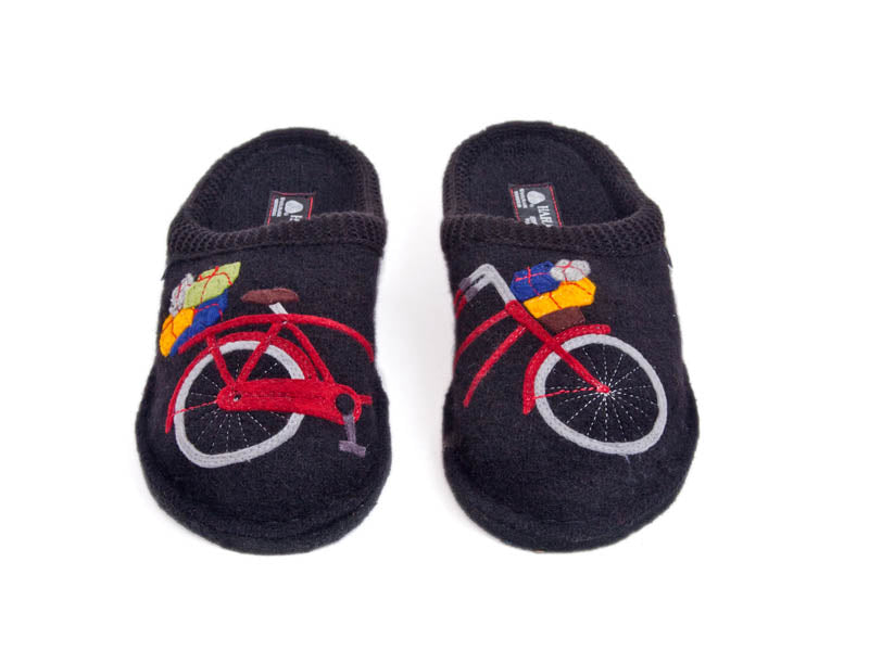 Black wool slippers with half a bright red bicycle - the other half is on the other slipper, carrying brightly coloured packages