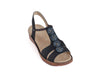 Navy blue sandal type shoe with back strap, open toes and four round bead decorations on the front. 