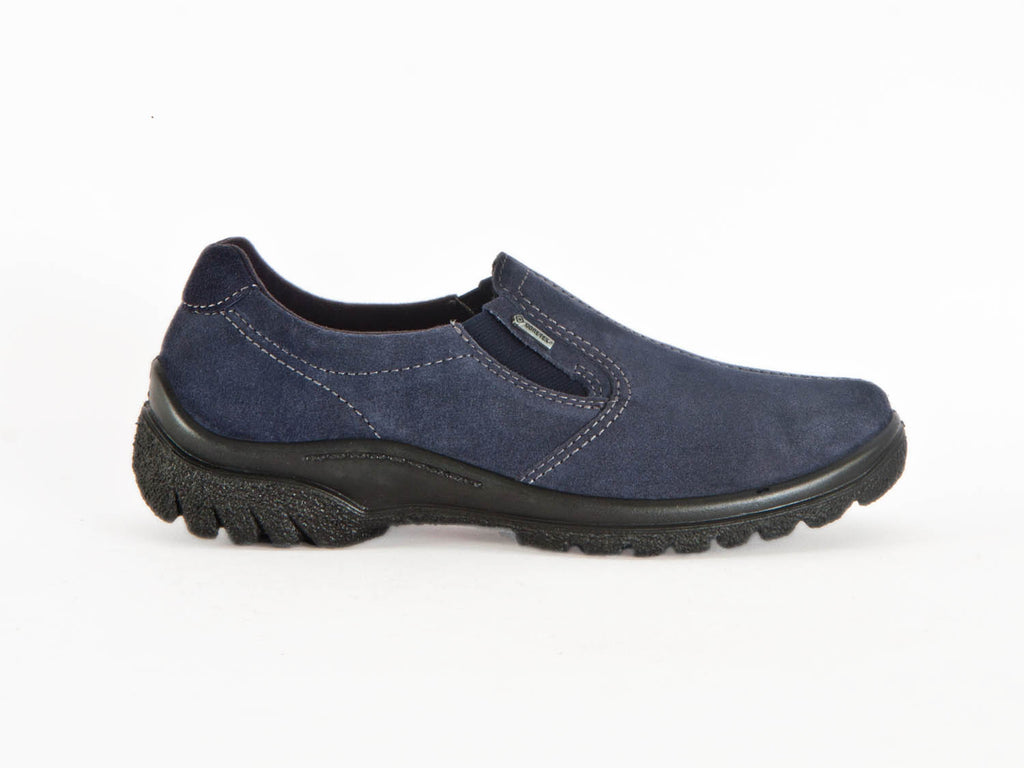 Navy blue nubuck leather slip on shoes with black ribbed sole and white feature sitting - at Ellie Dickins Shoes