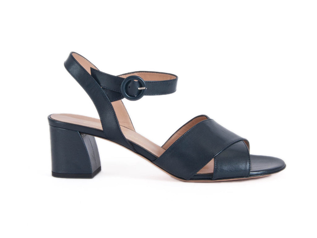 women's sandals with mid-height heel, leather crossover top with matching leather toe, and pretty round side buckle